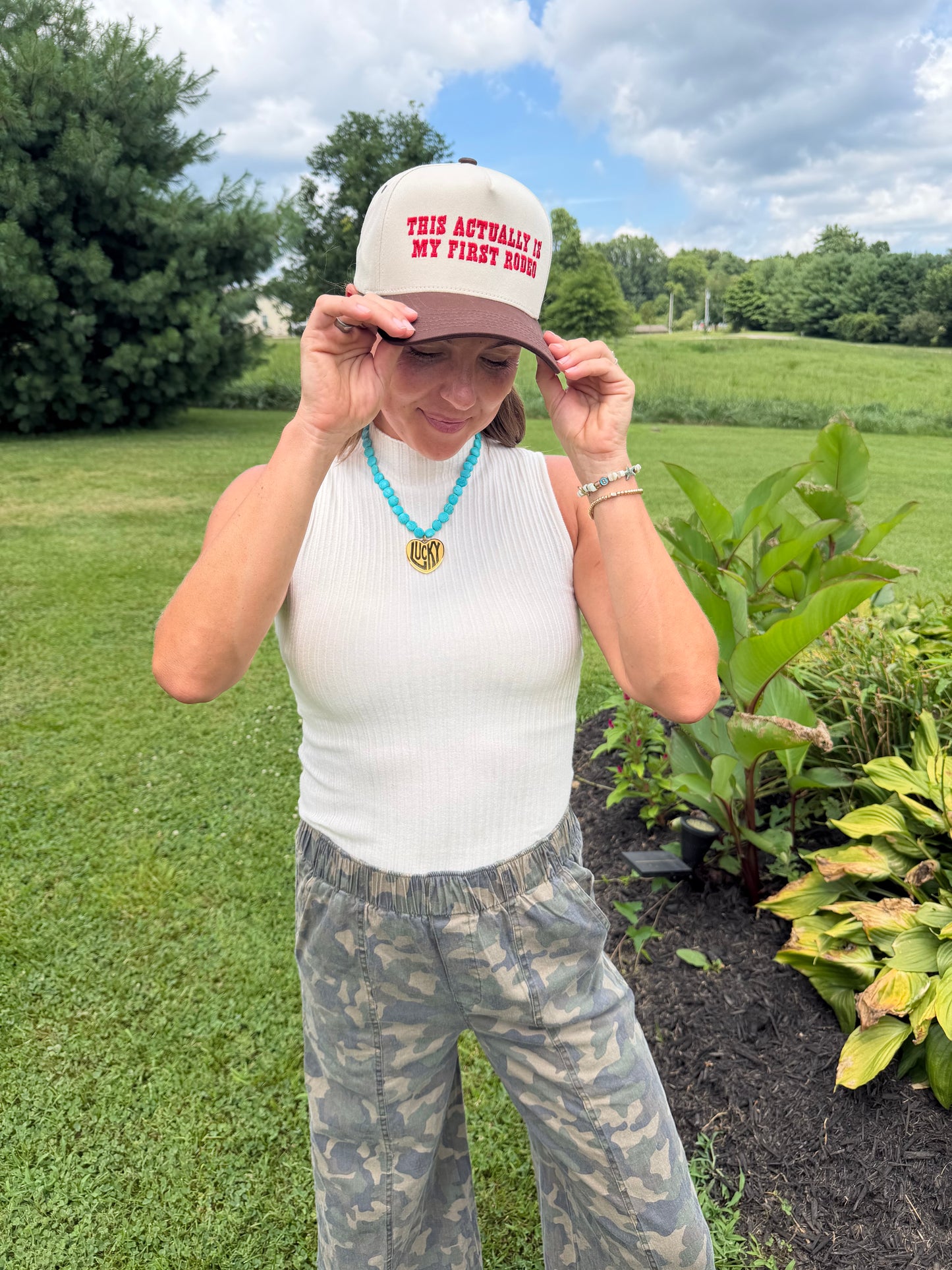 THIS ACTUALLY IS MY FIRST RODEO Trucker Hat